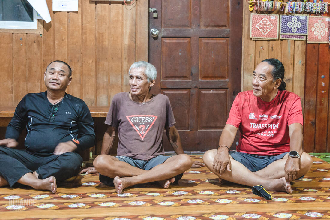The chief and guides inside the longhouse