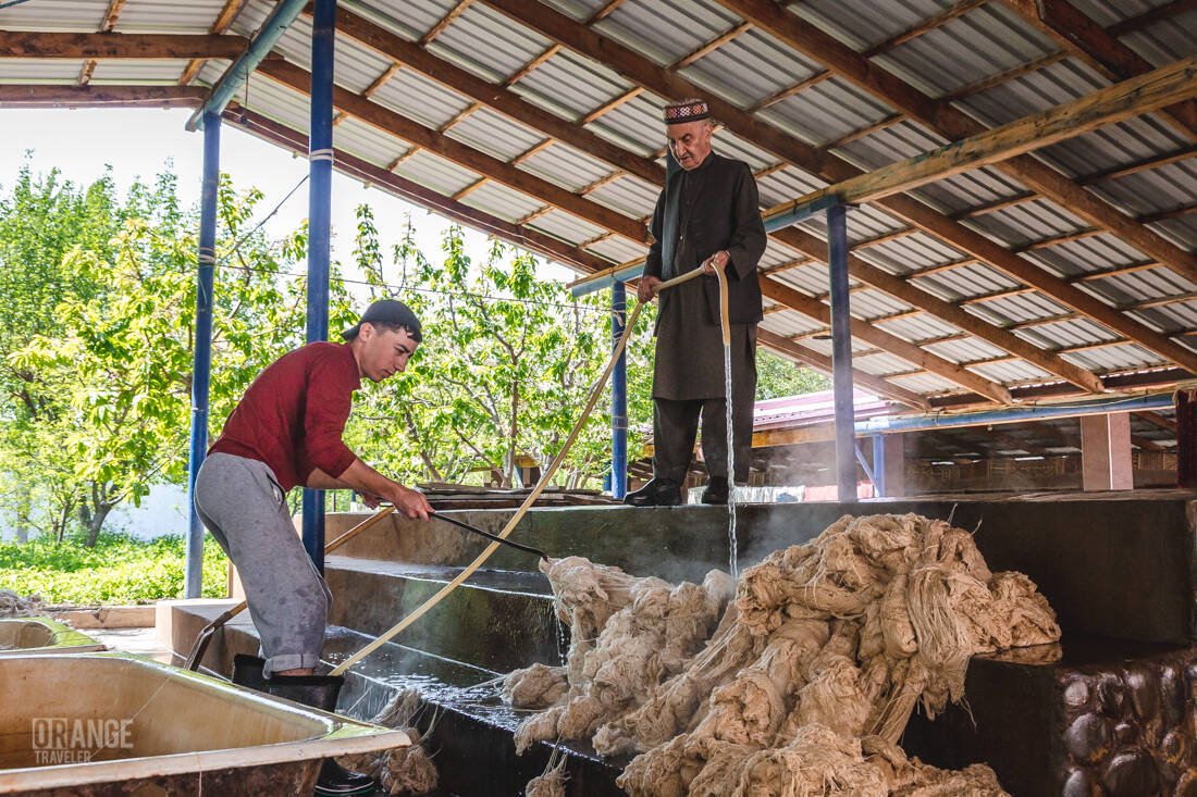 Workers at the Hujum carpet factory in Samarkand