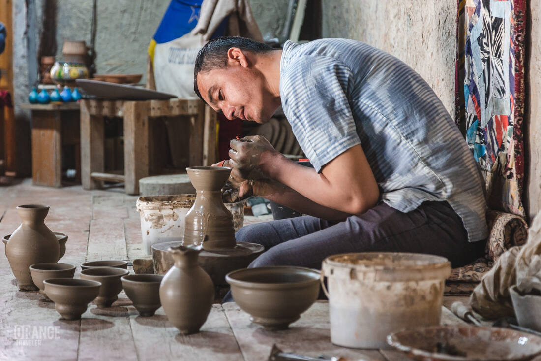 A master potter at the Narzullaev ceramics workshop
