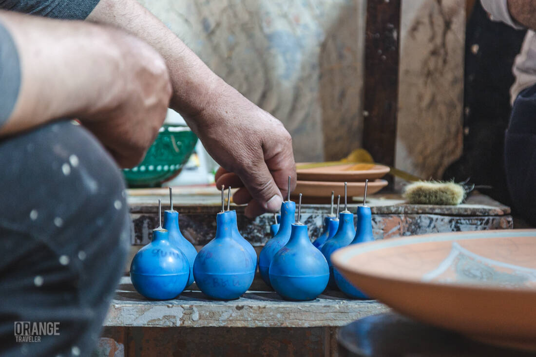 Paint-filled pipettes for decorating ceramics